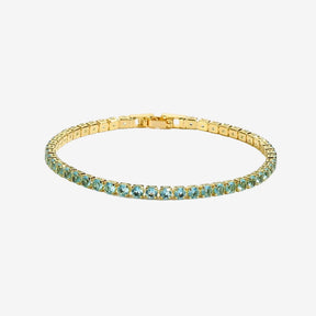 Pulseira Riviera Zircônia Doré dourada com pedras verdes em fundo branco